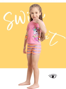 Detail of pink two-piece unicorn print swimsuit with rainbow ruffled short sleeves and shorts