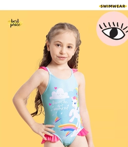 Detail of girls' unicorn swimsuit with pink ruffles and vibrant rainbow graphic print