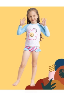 Detail of girls floral long sleeve swimsuit with sunflower print and ruffle hem