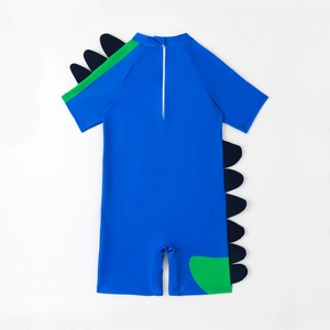 Kids one-piece dinosaur swimsuit in royal blue with green accents and 3D back fins