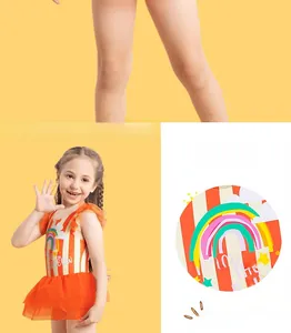 Detail of orange striped girls swimsuit with rainbow print and soft mesh tutu skirt