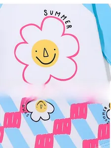 Close-up of girls' swimwear stitching featuring sun flower print and Summer text