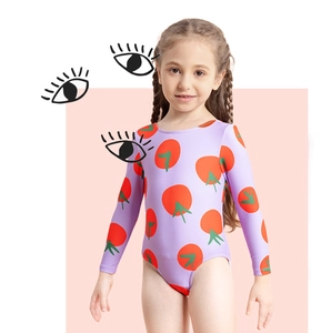 Detail of girls long-sleeve swimsuit featuring vibrant tomato prints on lavender fabric