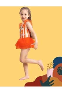 Detailed view of kids rainbow striped swimsuit with orange mesh tutu and vibrant print