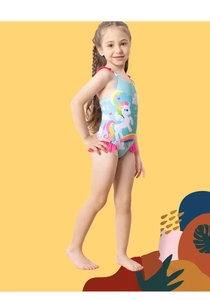 Detail of girls' unicorn swimsuit featuring ruffle trim and rainbow patterns on light blue fabric