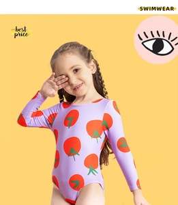 Detail view of purple girls long sleeve swimsuit with vibrant red tomato prints