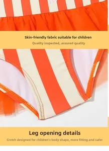 Detail of red and white striped kids swimsuit featuring skin-friendly fabric and orange tulle