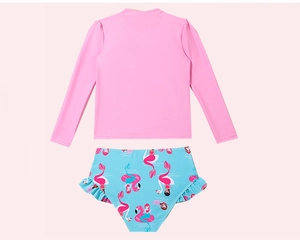 Flat lay of girl's pink long sleeve swim top with flamingo print ruffle bikini bottoms