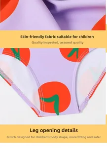 Macro detail of soft purple fabric with orange polka dots and reinforced leg opening seams