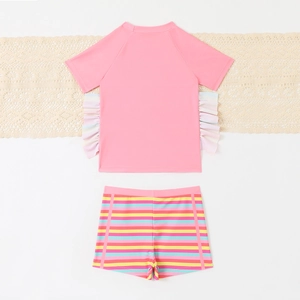 Girls' two-piece swimsuit with pink short sleeve top and rainbow striped swim shorts