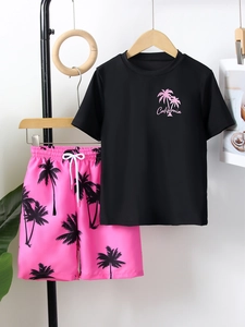 Detail of boys' palm tree print swimwear set with California graphic and quick-dry fabric