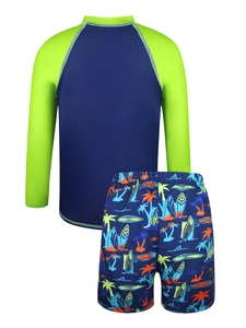 Detail view of boys long sleeve swimwear with vibrant tropical leaf print swim shorts