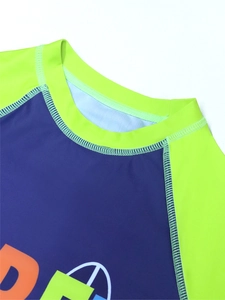 Detail of reinforced four-needle six-thread stitching on boy's long-sleeve swimwear