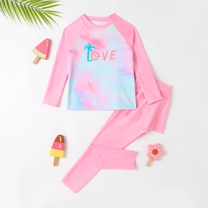 Girls' pink long sleeve tie-dye swimwear set with 'LOVE' print and skirted leggings