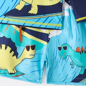 Detail of cartoon dinosaur print and flatlock stitching on kids long-sleeve swimsuit