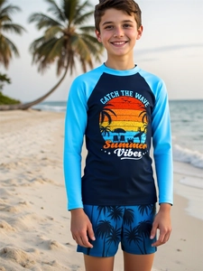Detail of boys long sleeve swimwear with beach sunset graphic and palm tree pattern