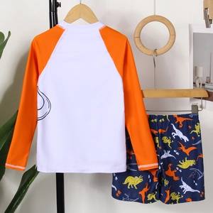 Costume da bagno due pezzi per bambini con maniche raglan arancioni e motivi di dinosauri