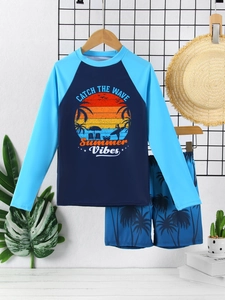 Detail of boys long sleeve sun protection swimwear with sunset beach print and swim shorts