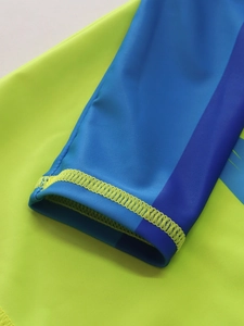 Detail of multi-color block sleeves with professional flatlock stitching for boy swimwear