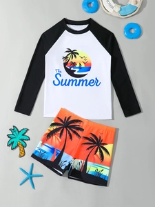 Flat lay of boys long sleeve swimwear set featuring sunset and coconut tree prints