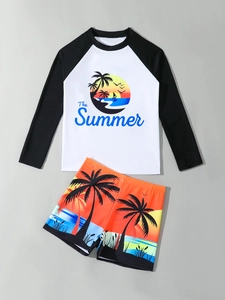 Close-up of boys long-sleeve swimwear featuring tropical coconut tree prints and quick-dry fabric