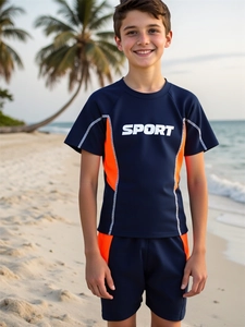 Detail of boys navy blue two-piece swimwear with orange side stripes and sport print