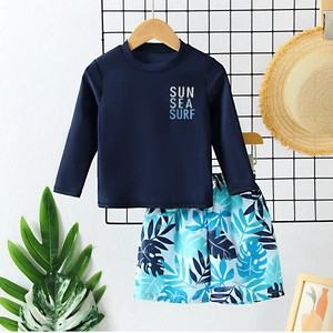 Kids long sleeve two-piece swimwear set with tropical leaf print and Sun Sea Surf logo