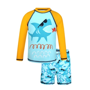 Kids' blue shark cartoon two-piece swimsuit with long sleeves and matching trunks