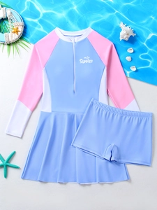 Detail of girls' long-sleeve sun protection swimwear with front zipper and pink accents