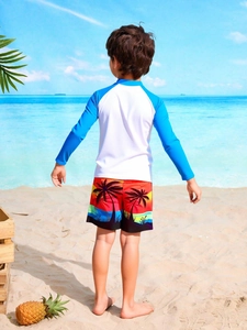 Kids quick-dry swim set with long-sleeve sun protection top and tropical palm tree shorts