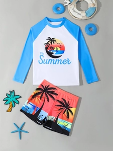 Flat lay of boys' two-piece swimsuit with long-sleeve sun protection top and beach shorts