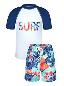 Close-up of boys' surf swimwear set with letter print top and tropical palm leaf shorts