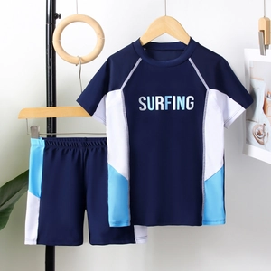 Two-piece boys surfing swimwear set with short sleeves and elastic swim shorts