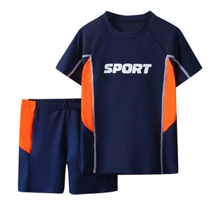 Boys two-piece navy and orange short sleeve swimsuit with SPORT print and swim shorts