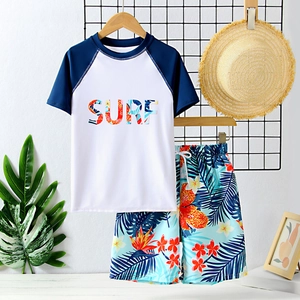 Two-piece boys surf swimwear with short sleeve shirt and tropical floral print shorts