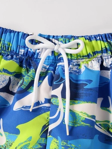 Detail of boys fast-dry swim shorts with shark print, elastic waistband and drawstring