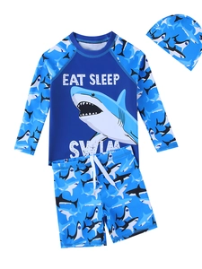 Three-piece boys' shark swimwear set with long sleeve top, swim trunks and matching cap