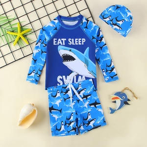 Three-piece boy's shark swimsuit set with long sleeve rash guard and swim cap