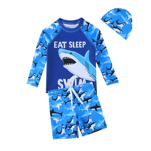 Three-piece boys shark swimsuit with long sleeve top, shorts and swimming cap