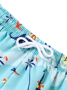 Detail of boys' dinosaur swim shorts featuring elastic waistband and adjustable white drawstring