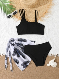Three-piece girls bikini set with black ribbed top and palm leaf print mesh skirt
