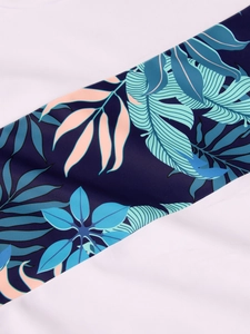 Detail of tropical palm leaf print on quick-dry fabric for boys' swimwear set