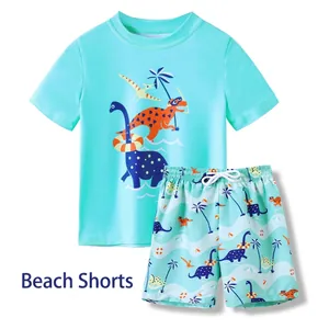Kids boys blue two-piece swimsuit with cartoon dinosaur print short sleeve top and shorts