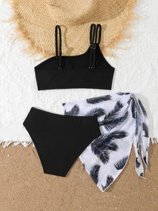 Detailed view of three-piece rib-knit bikini set with palm leaf print mesh sarong wrap