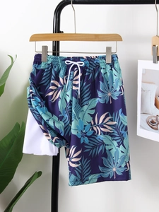 Detail of boys' swim trunks showing elastic waistband, white drawstring and quick-dry lining