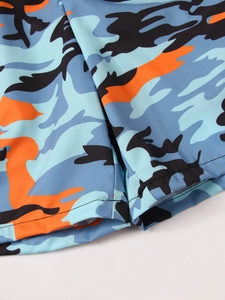 Detail shot of camo print swimwear featuring flat double-needle stitching and quick-dry fabric
