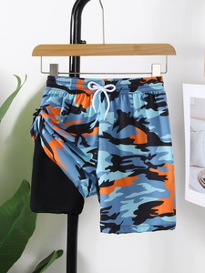 Detail of boys camouflage swim shorts with quick-dry fabric and adjustable drawstring