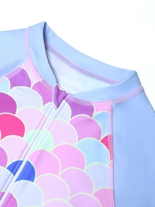 Close-up of front zipper and mermaid scales print on long sleeve girls swimwear