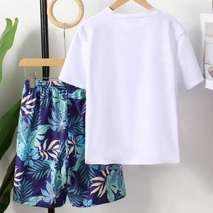 Two-piece boys quick-dry swimwear featuring a white short-sleeve top and tropical leaf print shorts