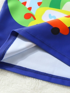Close-up of boys dinosaur swimwear featuring precise double-needle stitching details
